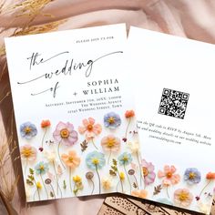 two wedding cards with flowers on them