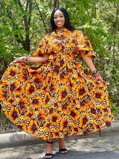 ✨ Embrace the beauty of African fashion and let your style shine bright with this exquisite piece. ✨ Our stunning African Print Floral Maxi Dress in a mesmerizing yellow print style. This elegant long dress effortlessly combines traditional African aesthetics with contemporary flair, creating a captivating ensemble that is perfect for any special occasion. Crafted with exquisite attention to detail, the dress features a striking floral print in rich shades of yellow, reminiscent of the sun-drenc Fitted Yellow Dress For Casual Wear, Gold Floral Print Maxi Dress, Yellow A-line Sundress, Yellow Sunflower Print Dress For Beach, Yellow Sunflower Print Beach Dress, Yellow A-line Maxi Dress For The Beach, Yellow A-line Maxi Dress For Beach, Yellow A-line Beach Maxi Dress, Yellow A-line Midi Dress For Casual Occasions