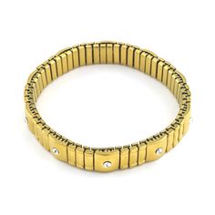 Adorn your wrist with the exquisite Gus Bracelet. Its unique stretch style allows for a perfect look on any wrist, while its brushed gold look exudes luxury. The sparkling crystal accents add a touch of elegance to any outfit. Elevate your style with this exclusive piece. Bracelets are 'one size fits most' and are designed to fit up to a 7.5" wrist comfortably. Lead & Nickel Free Please be aware that due to the unique and handmade nature of each product, colors, shapes, and bead sizes may vary s Gold Jubilee Stretch Bracelet For Formal Occasions, Elegant Gold Stretch Bracelet For Formal Occasions, Elegant Gold Stretch Bracelet Stackable, Gold Metal Stretch Bracelet For Parties, Elegant Adjustable Gold Stretch Bracelet, Elegant Gold Stretch Bracelet With Jubilee Style, Elegant Gold Stretch Bracelet For Party, Luxury Gold Crystal Bracelet, Luxury Gold Crystal Metal Bracelet