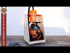 an orange and black vacuum sitting in front of a garage door with the words let's do this written on it