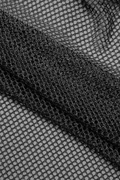 black mesh fabric with small circles on the top and bottom, as well as an image of