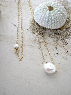 This is the perfect everyday necklace! you can pair it with your existing jewelry, layer it, and wear it day or night - casual or dressy! This necklace features a 9mm-10mm White Freshwater Keishi Pearl on your choice of Sterling Silver ($30) or 14k Gold-Filled ($35) chain. I paired a tiny white Simple Summer Jewelry For Gifts, Simple Summer Jewelry Gift, Minimalist Necklaces For Summer Gifts, Minimalist Everyday Necklaces For Summer, Single Pearl Pendant, Pearl Gold Necklace, Floating Pearl Necklace, Necklace White Gold, Single Pearl Necklace