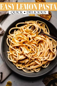 an easy lemon pasta recipe in a black bowl with a serving spoon on the side