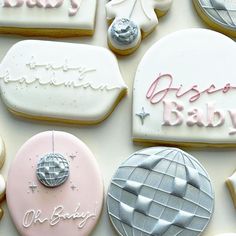 decorated cookies with baby names on them and balloons in the background, including an air balloon