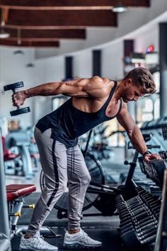 a man working out with dumbbells in a gym