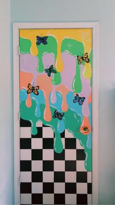 a door with butterflies painted on it and checkered flooring in front of the door