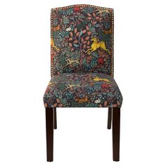 an upholstered chair with a colorful animal design