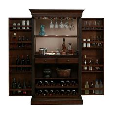 a tall wooden cabinet filled with lots of bottles