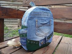 Recycled Denim Blue Backpack, Backpack for School. Stylish backpack manufactured from jeans and leather. A basic fabric backpack with three external pockets. There are two side pockets . The inside of the bag has a polyester lining and internal pockets, perfect for keeping valuables. The backpack is made of denim and padded with material to keep its shape even when it is empty. Very soft and lightweight but durable. This backpack has enough space inside to carry all your necessaries. That's why it's so good for light walking or everyday use. It can be used in travel. CARE: hand wash or wash machine delicate cycle 30 degrees.  Note that the different colors of the computer screen may vary slightly. The backpack approximate measurements are: 29cm x 22cm x 8,5cm;11,4in x 8,7in x 3,3in Fabric Backpack, Jeans Backpack, Urban Backpack, Backpack For School, Jean Backpack, Stylish Backpack, Fabric Wallet, College Bags, Upcycle Jeans