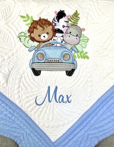 a blue car with animals on it and the name max