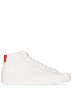 Looking to upgrade your sneaker collection to the next level? Why not lace yourself up into these bright white leather Pro Model high top sneakers from adidas and 424 that are almost too beautifully minimal that you won't want to wear them out the house. Just maybe don't wear them to the club straight away. Featuring a round toe, stitched panels, a lace-up front fastening, punch hole detailing, a signature three stripe detail, branded heel counter and a flat rubber sole. POSITIVELY CONSCIOUS: Ad Adidas Nizza, Adidas High Tops, Adidas High, High Top Trainers, Top Sneakers Women, Sneakers Looks, Red Heels, Adidas X, Sneaker Collection