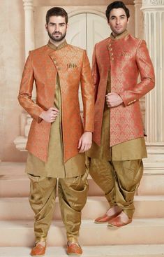 two men standing next to each other wearing orange and gold colored outfits with matching shoes