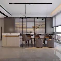 a modern kitchen with an island and dining table next to the window overlooking the city