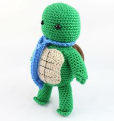 a crocheted turtle with a backpack on its back