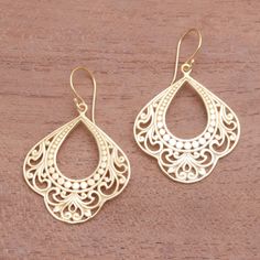 Original and elegant these dangle earrings are created by Ari Gunawan in Bali. Two lithe shapes are crafted from sterling silver bathed in 18k gold revealing intricate openwork patterns. Gold Sterling Silver Filigree Chandelier Earrings, Gold Filigree Sterling Silver Chandelier Earrings, Gold Plated Filigree Teardrop Jewelry, Teardrop-shaped Gold Plated Filigree Jewelry, Ornate Sterling Silver Earrings With Elegant Design, Filigree Teardrop Chandelier Earrings, Teardrop Filigree Chandelier Earrings, Traditional Pierced Drop Jewelry, Elegant Gold Chandelier Earrings In Sterling Silver