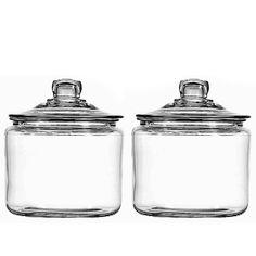 two clear glass jars with lids on each one and the other side is closed up