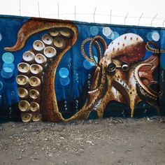 an octopus painted on the side of a wall