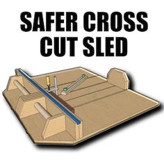 a wooden box with tools in it and the words safer cross cut sled above it