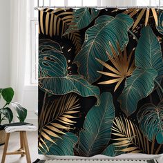 a shower curtain with gold and green leaves