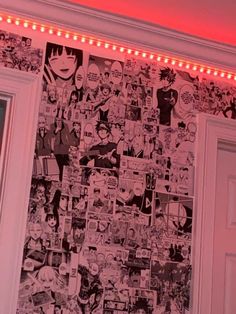 a wall covered in cartoon pictures and lights