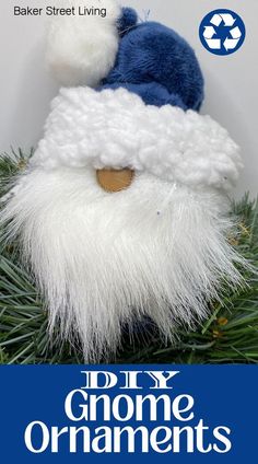 a close up of a santa clause ornament on top of a christmas tree