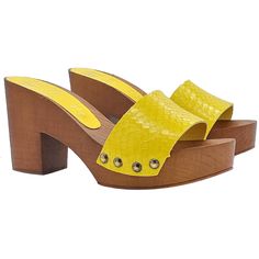 Clogs with polyurethane structure (wood effect) Upper in genuine yellow leather with scale effect texture Wide and comfortable heel - 9 cm high and 3 cm plateau Handcrafted by specialized Italian personnel. BEFORE COMPLETING YOUR PURCHASE DO NOT FORGET TO CHECK THE SIZE! Yellow Synthetic Mules With Round Toe, Yellow Platform Clogs, Yellow Platform Clogs With Round Toe, Yellow Platform Clogs For Summer, Yellow Open Toe Heels With Wooden Heel, Synthetic Clogs With Wooden Block Heel, Yellow Leather Sandals With Wooden Heel, Yellow Sandals With Wooden High Heel, Yellow High Heel Sandals With Wooden Heel