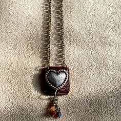 10 Inch Silver Heart On Leather Gold Bear Claw Closure Chain Never Worn Adjustable Metal Heart Necklace With Charm, Silver Heart Charm Necklace, Unique Metal Jewelry With Heart Charm, Adjustable Metal Heart Necklace, Unique Metal Necklace With Heart Charm, Handmade Metal Heart Charm Necklaces, Unique Silver Heart Necklace With Charm, Nickel Free Metal Heart Necklace, Nickel Free Adjustable Heart Pendant Necklace