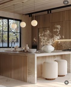 a kitchen with marble counter tops and white stools