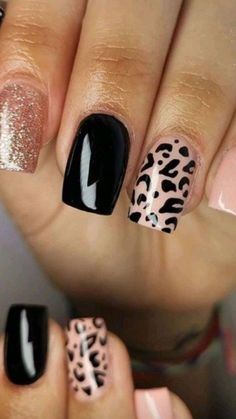 some black and white nails with leopard print on them