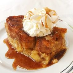 a piece of bread pudding with whipped cream on top