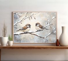 two birds are sitting on a branch in front of a white and gray painting with snow