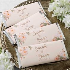 wedding place cards on a tray with flowers