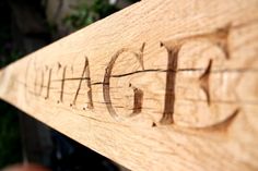 a close up of a wooden sign with the word chicago engraved on it