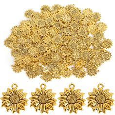 gold plated metal charms and pendants with flower design on each side, set against a white background