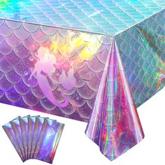 an image of a table cover with holographics and mermaid fish on it