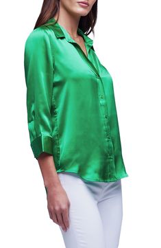 This elevated version of the classic button-up is cut from lustrous silk charmeuse with a smooth drape. 27" length (size Medium) Front button closure Spread collar Three-quarter sleeves with button cuffs Curved hem 100% silk Dry clean Imported via C Classic Solid Blouse For Evening, Sleek Solid Silk Blouse, Elegant Silk Blouse With Satin Finish, Silk Blouse For Evening, Sleek Satin Finish Blouse For Formal Occasions, Silk Satin Finish Blouse For Workwear, Sleek Satin Blouse, Classic Fitted Satin Blouse, Classic Silk Blouse For Evening