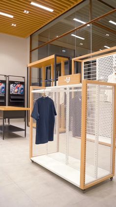 a room filled with lots of white lockers and wooden shelves next to each other