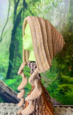 a knitted hat and scarf on top of a mannequin's head