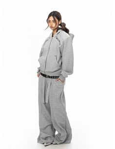 Step into comfort with our Zippered Hoodie and Jogger Lounge Set, where style meets relaxation. 

Made with a high composition of polyester, our set assures both softness and durability. The three-dimensional cardigan offers a cozy hood, structured shoulder pads, and an easy zippered front, making it a standout piece. Long sleeves paired with matching jogger trousers encapsulate the essence of laid-back sophistication with a hint of edgy flair. 

The set's versatility shines through when styled Structured Shoulder, Lounge Set, Lounge Sets, Fashion Mode, Zipper Hoodie, Shoulder Pads, Three Dimensional, Jogging, Korean Fashion