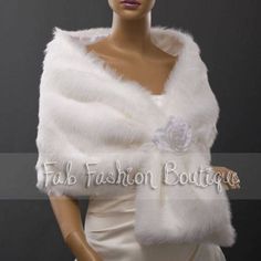 "This warm and luxurious faux fur shawl is a perfect gift for your wedding party! The shawl is 65\" long x 14\" wide. It's finished on both sides, with a matching colored satin lining. *You can add a matching fur muff ($16.00). Muff is finished on both sides, with fur lining. It is approx. 14 \" long x 7.5\" wide *Rose flower tie is extra $3.00. All fur products are made in Canada at our sewing studio. Normally we ship non-rushed orders within 3 business days after you make your payment. Return Elegant White Fluffy Fur Coat, White Fluffy Elegant Fur Coat, Elegant Cream Faux Fur Coat, Winter Wedding Fur Coat With Faux Fur Trim, Winter Wedding Fitted Shawl, Elegant Wedding Fur Coat With Faux Fur Trim, Elegant Fur Coat With Faux Fur Trim For Wedding, Elegant Winter Wedding Fur Coat, Faux Fur Wedding