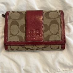 Deep Red /Brown Wallet Great Condition Never Used Coach Red Bifold Wallet, Red Coach Wallet With Interior Card Slots, Red Coach Wallets With Interior Card Slots, Coach Brown Coin Purse For Travel, Red Coach Leather Wallet, Red Leather Coach Wallet, Red Keychain, Red Wallet, Brown Wallet