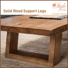 a wooden table sitting on top of a carpeted floor next to a rug with the words solid wood support legs