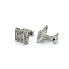 Are you trying to find the perfect accent to match your new business or formal outfit? Look no further. Juzar Tapal Collection is proud to present the ultimate pair of statement and glittering cufflinks set with VVS Zircon. The square design of these cufflinks for men makes the piece sparkling but simple, and the 925 Silver with steel plating adds an attractive touch to the piece. The addition of zircon cufflink studs to your tuxedo is a reliable way to elevate the degree of sophistication of yo Classic Gold Cufflinks For Party, Elegant Silver Cufflinks, Elegant White Gold Cufflinks For Business, Elegant White Gold Cufflinks For Anniversary, Luxury Polished Finish Cufflinks For Formal Occasions, Luxury Polished Cufflinks For Formal Occasions, Luxury Cufflinks For Formal Occasions, Designer Silver Cufflinks For Wedding, Luxury White Gold Cufflinks For Wedding