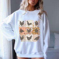 Cute Girly Floral Rooster Graphic Sweatshirt Size Chart in description Photo's- If you want to achieve a oversized look, consider sizing up a size or two. Care: Machine wash cold, lay flat to dry or turn inside out and tumble dry. Do not iron or take to dry cleaner.  Modern Nostalgia Co Boutique: https://modernostalgiaco.etsy.com Free Shipping-Over $35 or more Pre-orders may take one to two weeks to process. If in stock order will ship within one to three business days. Oversized Spring Tops With Cartoon Print, Oversized Printed T-shirt For Fall, Printed Relaxed Fit Sweatshirt For Fall, Oversized Long Sleeve Top With Funny Print, Spring Cotton Sweatshirt With Cartoon Print, Spring Cartoon Print Relaxed Fit Sweatshirt, Relaxed Fit Cartoon Print Sweatshirt For Spring, Relaxed Fit Cartoon Print Top For Fall, Spring Cartoon Print Crew Neck Sweatshirt