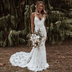 a woman in a wedding dress holding a bouquet