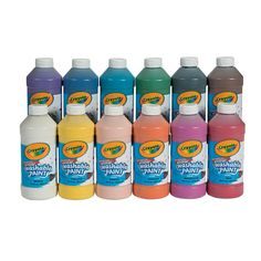 six bottles of multicolored liquid are lined up