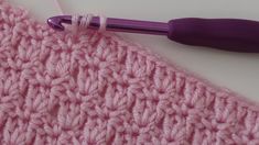 the crochet stitch is being worked on