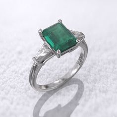 Art deco emerald engagement ring 2-carat Colombian emerald lab-grown 8.5x6.5mm & 2 Sided Moissanite baguette tapered MORE INFORMATION ❥ The craft period is about 5-7 business days. ❥ Free shipping via DHL ❥ Available in a combination of 14K Rose Gold, 14K Yellow Gold, 14K White Gold ❥ Arrives in our box, ready for gift-giving (and proposing ) ❥ GioielliRings engagement ring : Gem Type- lab-grown Colombian emerald Weight-2 ct (approx) Size- 8.5x6.5mm Color- Green Clarity- Cut(Shape): Brillian Classic Emerald Ring With Baguette Cut, Classic Trillion Cut Emerald Ring For Formal Occasions, Green Moissanite Emerald Ring With Baguette Cut, Classic Formal Trillion Cut Emerald Ring, Formal Emerald Cut Moissanite Ring, Classic Green Emerald Ring With Baguette Diamonds, Classic Trillion Cut Emerald Ring, Classic Trillion Cut Emerald Ring With Prong Setting, Elegant Gia Certified Trillion Cut Emerald Ring