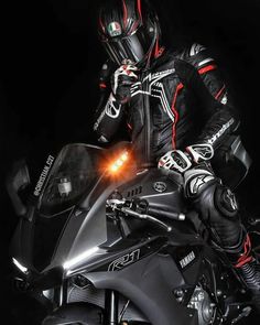 a person on a motorcycle in the dark