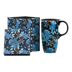 a blue flowered mug and coaster set on a white background